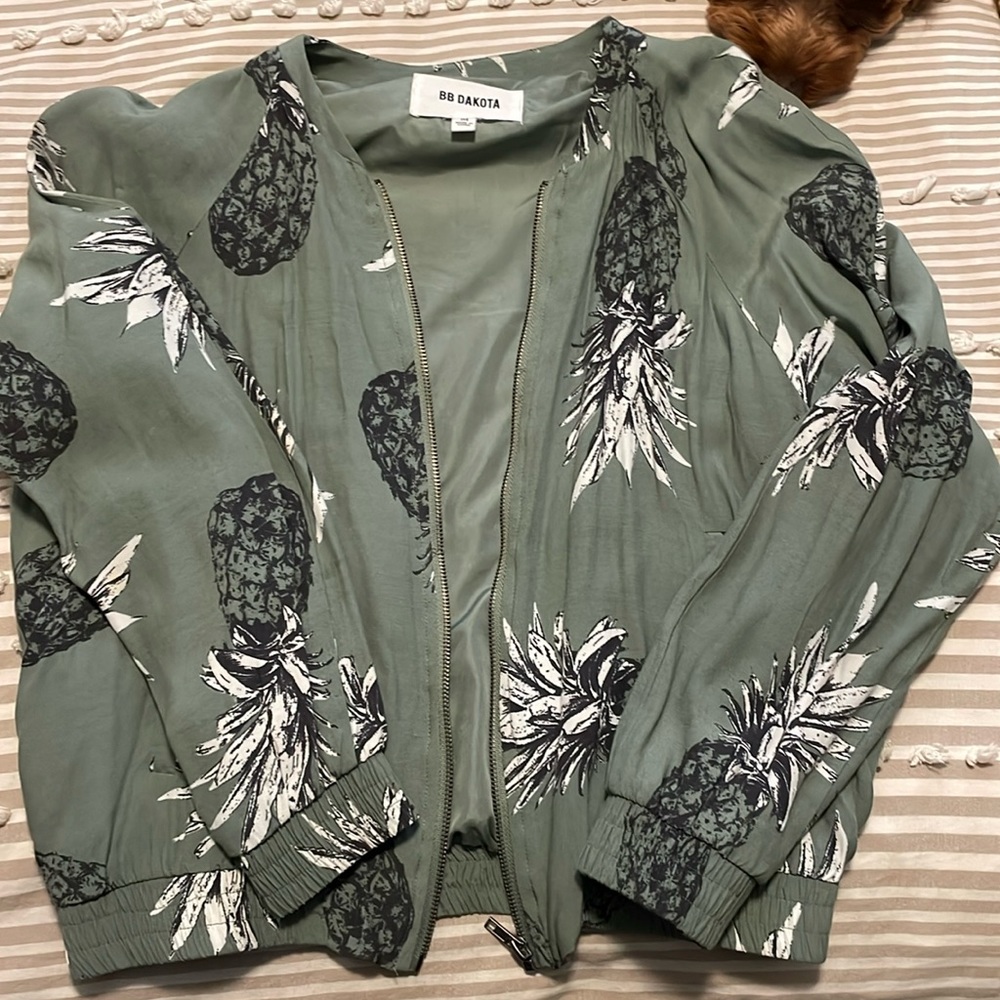 Green bomber jacket with pineapple detail